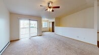 This well-designed apartment offers 1230 square feet of living space on a single floor. The layout includes two bedrooms, with the primary bedroom boasting a generous 210 square feet. Two full bathrooms provide convenience and privacy. The modern kitchen is a standout feature, equipped with light wood cabinetry, granite countertops, and black appliances including a refrigerator, stove, and dishwasher. The open concept design seamlessly connects the kitchen to the living area, which is brightened by large windows and a sliding glass door. Plush carpeting in the bedrooms and living spaces adds comfort, while the kitchen and bathrooms feature durable flooring. The apartment includes two laundry areas with in-unit washer and dryer connections. Ceiling fans in the bedrooms and living room provide air circulation. The bathrooms are fitted with granite vanities and modern fixtures. Built-in closets offer ample storage space throughout. Located at 520 Moon Lake Dr in Rice Lake, Wisconsin, this apartment combines comfort and functionality in a well-maintained setting.