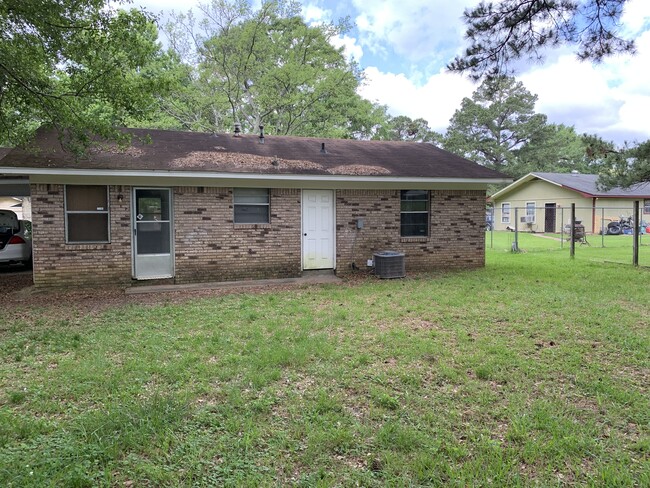 Back of the house with storage and laundry room - 5148 Queen Eleanor Ln