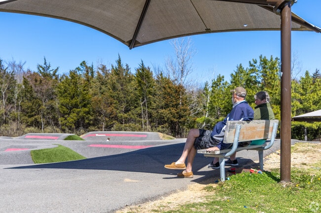 Families enjoy various activities at the Paris Sports Complex in Paris.