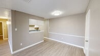 Located at 1100 Willow Springs Rd in Killeen, Texas, this single-story, 4-bedroom, 2-bathroom home offers a practical and well-organized layout. The living area features light wood-style flooring, neutral taupe walls, white baseboards, and a textured ceiling, creating a clean and cohesive aesthetic throughout. A distinctive kitchen pass-through window with overhead cabinetry connects the kitchen to the living room, promoting an open and communicative flow between spaces. The kitchen itself is efficiently designed with white cabinetry, laminate countertops, and black appliances including a range and refrigerator, complemented by light flooring that carries throughout the home. Each of the four bedrooms is appointed with the same wood-style flooring, neutral walls, and ceiling fans with integrated lighting. Windows with horizontal blinds bring in natural light while maintaining privacy. The primary bedroom offers a comfortable footprint with a dedicated closet featuring a full-width hanging rod. The bathrooms include a tub-shower combination with white tile surround. A dedicated closet provides additional storage. The overall ambiance is clean, neutral, and move-in ready, well-suited for comfortable everyday living.