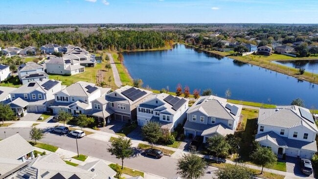 Building Photo - 4 Bedroom 2.5 bath LUXURY Lake Nona Storey Park Pool Home with Solar Panels and a Pond View!