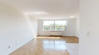 Located at 4979 Bathurst Street, Suite 603 in Toronto's North York neighbourhood, this one-bedroom, one-bathroom unit offers a well-organized and efficiently designed layout across a single floor. The living area features warm parquet wood flooring that extends throughout the main spaces, contributing to a bright and welcoming ambiance, with natural light filtering in from the windows.

The kitchen is a functional highlight, outfitted with crisp white cabinetry reaching toward the ceiling for ample storage, dark countertops, a white subway tile backsplash, and a full suite of stainless steel appliances including a refrigerator, electric range, and built-in microwave. Light tile flooring demarcates the kitchen from the rest of the unit. The open adjacency between the kitchen and living area supports a practical, connected flow.

The bedroom is a comfortable, well-proportioned room with parquet flooring, neutral white walls, and a mirrored sliding-door closet that adds depth and storage convenience. A dedicated closet provides additional storage options within the unit.

The bathroom is finished with classic white subway tile surrounding the combined tub and shower, complemented by a modern vanity with ample under-sink storage, stone-look floor tile, and clean, bright fixtures throughout. The overall aesthetic of the unit is clean, neutral, and move-in ready.