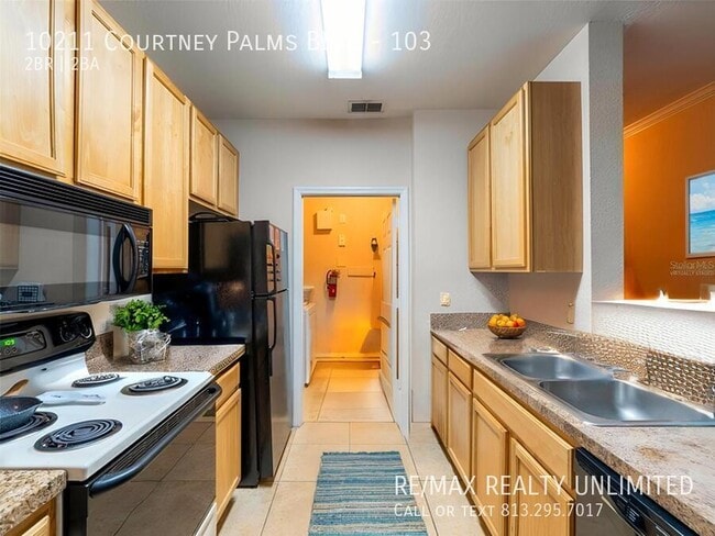 Photo - 10211 Courtney Palms Blvd Apartment