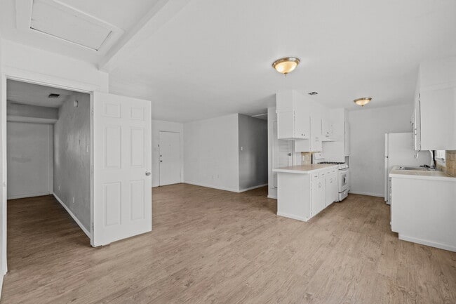 Building Photo - Updated Home with Gorgeous Floors & Large Backyard