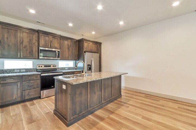 Building Photo - Modern End Unit townhouse w attached 2 car...