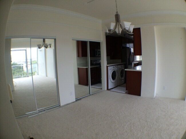 Living Room View toward Kitchen / Living Room Closet with Mirror Sliding doors - 1710 Punahou St