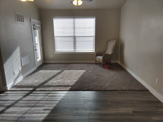 Living room with door to patio. - 4166 W 1850 North #H303