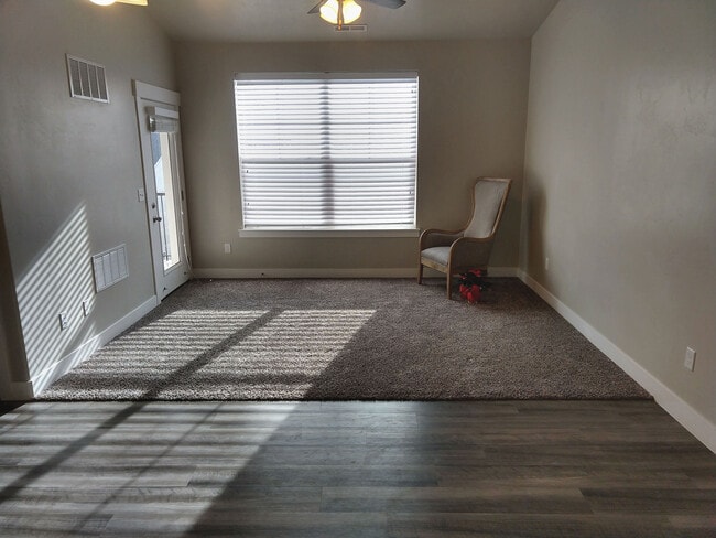 Living room with door to patio. - 4166 W 1850 North #H303