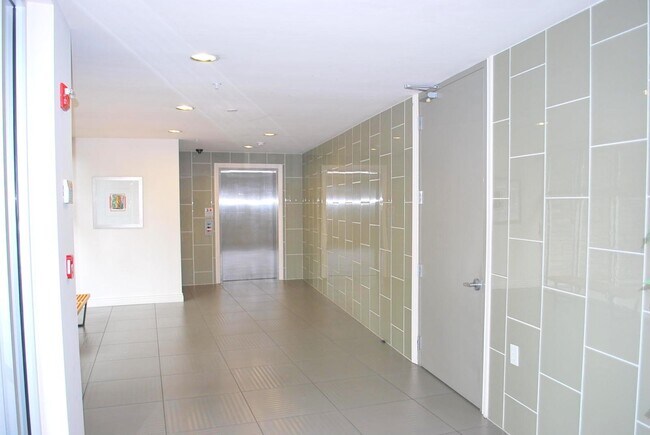 Lobby / elevator and door to garage - 1310 Creekside Dr