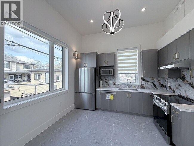 Photo du bâtiment - 10XX E 62nd Ave