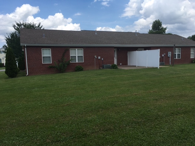 Back of duplex with patio and yard. - 907 Bagwell Dr