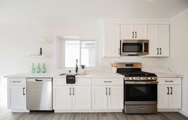 Building Photo - AMERICANA Property Mgmt - Remodeled 4 beds...