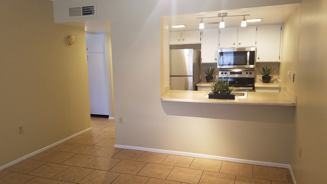 Updated kitchen with new SS appliances. - 3033 E Devonshire Ave