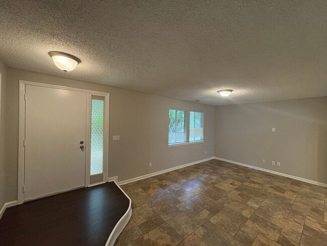 Building Photo - Four Bedroom Townhome Available Now
