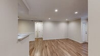 Located at 7277 NE Dunwoody Rd in Atlanta, GA, this well-appointed one-bedroom, two-bathroom residence offers a thoughtfully designed single-floor layout. The open living area is a welcoming focal point, featuring warm hardwood-style flooring, crown molding, recessed lighting, and a large window that fills the space with natural light and views of lush greenery. A pass-through connects the living area to the galley-style kitchen, which is outfitted with rich dark wood cabinetry, granite countertops, a stainless steel sink, and stainless steel appliances including a refrigerator, dishwasher, and range — all illuminated by recessed ceiling lights and crown molding. A connecting hallway with louvered closet doors and wood-style flooring leads to the private bedroom, which is carpeted and features crown molding, a ceiling fan with light fixture, and a window overlooking greenery, creating a comfortable and tranquil retreat. Two bathrooms serve the residence, with one featuring a classic tiled tub-shower combo. A dedicated closet provides convenient storage. The space combines functional design with clean, neutral finishes throughout.