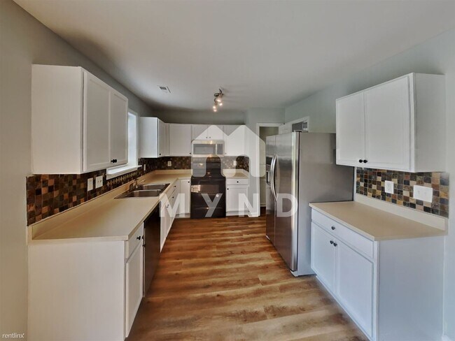 Foto del edificio - 4 br, 2.5 bath House - 312 N Waters Edge Dr