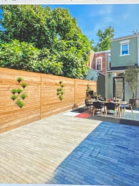 Rear paved yard with room for entertaining & parking! - 602 14th Pl NE