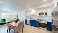 Located at 4064 E Live Oak Ave in Arcadia, CA, this thoughtfully designed 2-bedroom, 2-bathroom residence offers a modern open-concept layout across a single floor. The combined dining room and kitchen serves as a striking centerpiece, featuring bold two-tone cabinetry with crisp white upper cabinets and deep navy lower cabinets, a white subway tile backsplash, light quartz countertops, and a full suite of stainless steel appliances. Light wood-style flooring flows throughout the main living areas, enhancing the bright and airy atmosphere. The living room is bathed in natural light through a large sliding glass door that opens onto a private balcony, offering open views of the surrounding Arcadia neighborhood and mature tree canopy. The primary bedroom is a comfortable retreat with direct balcony access, generous windows, and a well-appointed closet. The second bedroom is equally well-lit and includes its own closet. Both bathrooms are finished with clean, contemporary details, with one featuring a glass-enclosed walk-in shower with white tile surround and dark hardware accents. Additional conveniences include four closets and a dedicated in-unit laundry area. The residence is part of a modern multi-story building with structured parking.