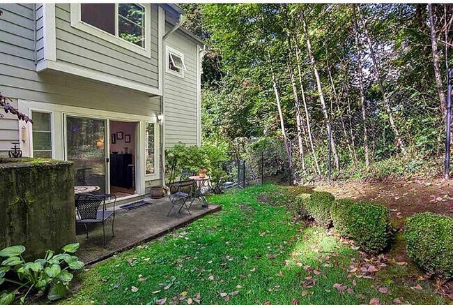 back patio and green space behind unit - 9700 Ravenna Ave NE