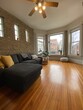 Westward facing bay window and brick wall. - 909 N Winchester Ave