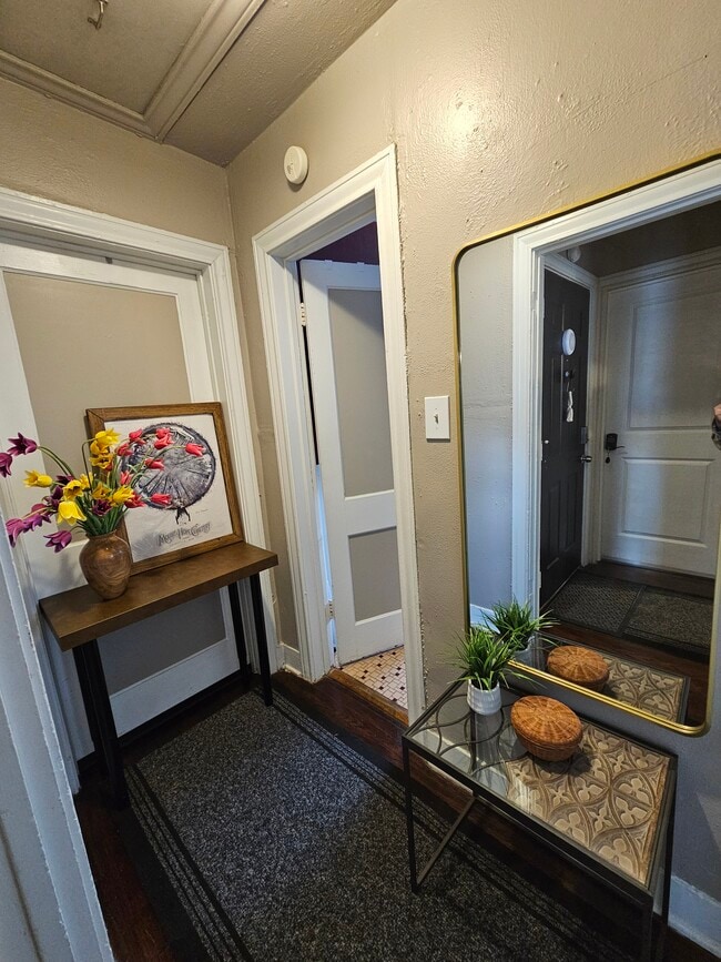 Hallway has coat hooks. - 2506 Elmen St
