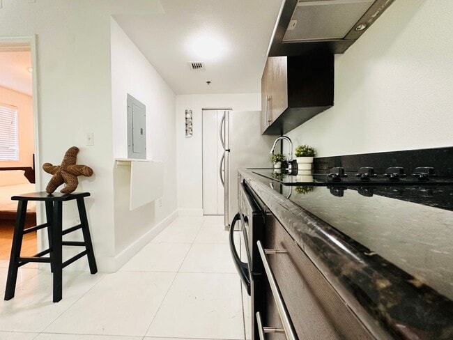 Building Photo - Bright and furnished 1/1 in classy remodel...