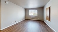 This 590 square foot apartment in South Milwaukee offers a thoughtful layout that maximizes space and functionality. The single-floor design features an open-concept living area that seamlessly integrates the kitchen and living room. The kitchen boasts modern stainless steel appliances, light wood cabinetry, and a practical peninsula with a granite-look countertop, perfect for meal prep or casual dining.

Throughout the apartment, wood-look flooring adds warmth and durability, while neutral-toned walls provide a blank canvas for personalization. The 140 square foot bedroom is generously sized, with a large window allowing natural light to flood the space. A closet with sliding doors offers ample storage.

The bathroom is efficiently designed with a combined tub and shower unit, featuring built-in shelving for convenience. Recessed lighting and a combination of natural and artificial light sources create a bright, airy atmosphere throughout the apartment. Baseboard heating ensures comfort year-round.

Large windows in the living area and bedroom not only provide natural illumination but also offer views of the surrounding area. The apartment's layout, with its well-defined spaces and modern amenities, creates a comfortable and inviting home perfect for urban living.