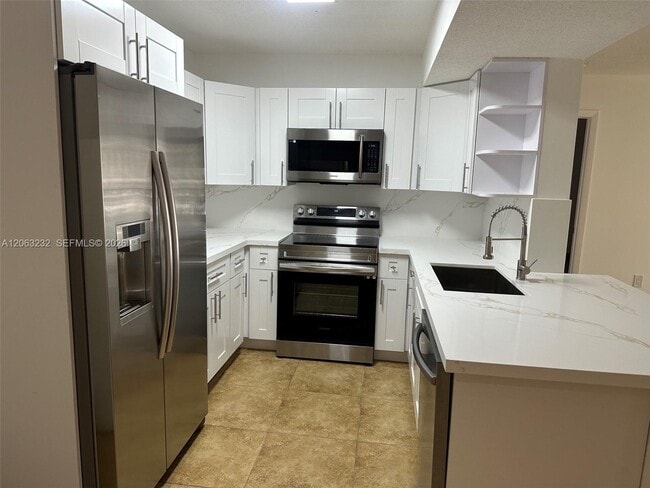 Building Photo - 9491 Palm Cir S