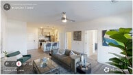 Located in Durham, NC, this thoughtfully designed 2-bedroom, 2-bathroom residence offers a comfortable and functional single-floor layout. The open-concept living room greets you with rich hardwood-style flooring, a ceiling fan with light fixture, and generous natural light streaming through large windows and glass-paneled doors — creating a bright, welcoming atmosphere ideal for both relaxing and entertaining.

The kitchen is a standout feature, showcasing granite countertops, a peninsula island with an undermount sink, stainless steel appliances including an electric range and refrigerator, a sleek stainless range hood, and soft-gray cabinetry with ample storage. Pendant lighting above the island adds a polished finishing touch.

The spacious primary bedroom features plush carpet, a ceiling fan, and large windows that invite natural light. It connects to a well-organized walk-in closet outfitted with wire shelving and hanging rods, along with a private en-suite bathroom featuring a glass-enclosed shower. The second bedroom is equally comfortable, also carpeted with good natural light. The second bathroom offers a full tub/shower combination with a curtain rod and wood-look tile flooring. Two closets throughout the home provide additional storage solutions for everyday living.