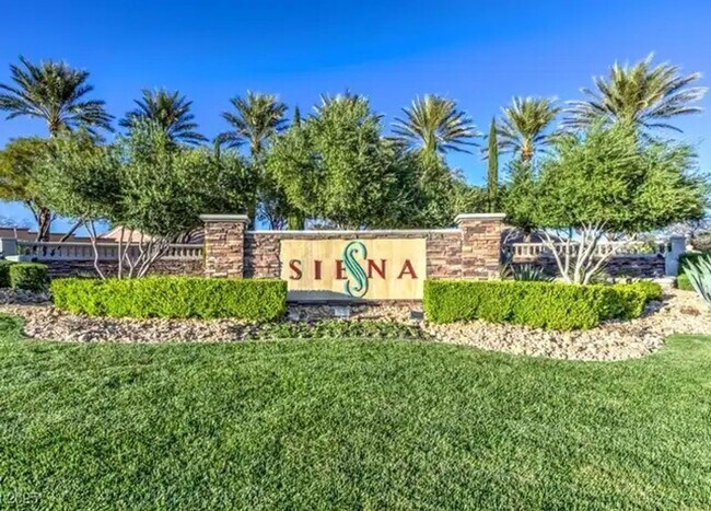 Building Photo - Live in the prestigious guard-gated Siena ...