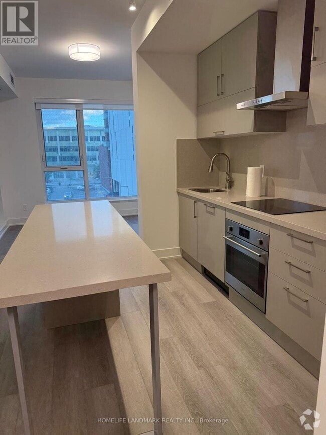 Building Photo - 38-D438 Andre de Grasse St