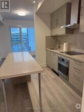 Building Photo - 38-D438 Andre de Grasse St