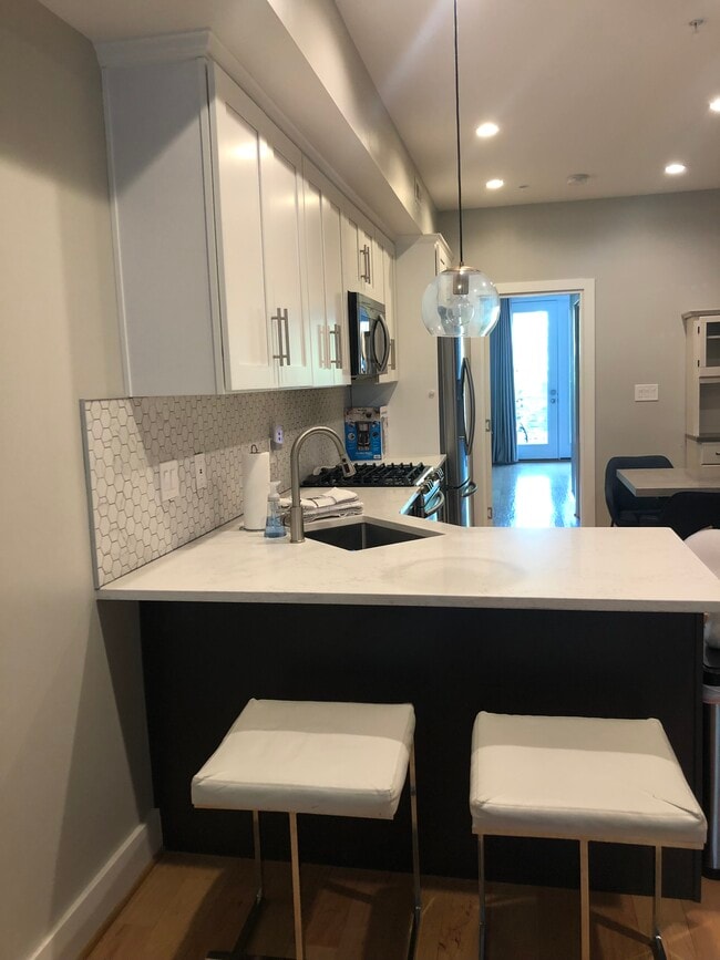 Kitchen leading to primary bedroom #2 - 614 I St NE