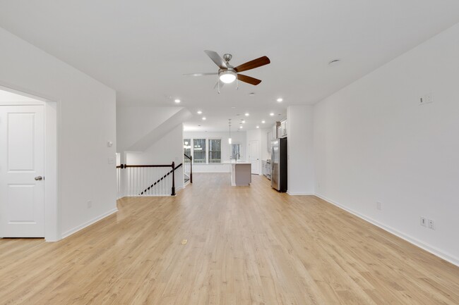 Open Floor Plan. Living Room looking into Ktichen/Dining Area - Greystone Suwanee