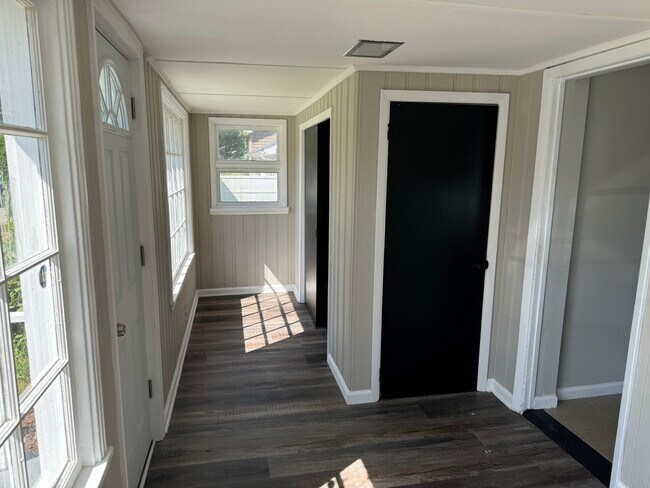 Entry sunroom with lots of closet space - 36229 N Riverview Dr