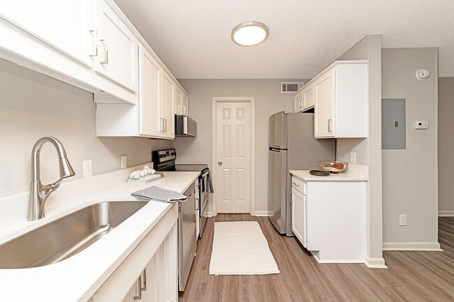 Kitchen with quartz counters, stainless appliances, and modern cabinetry - Vetra Providence