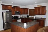 Kitchen (Gas Stove, Dishwasher,Double Door Refrigerator, Coffee Maker, Island w/Storage, Hardwood) - 209 Hilltop Dr SW