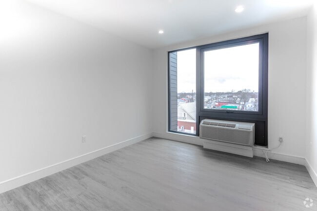 Delos- 1BR,1BA - 642SF-Living Room - The Promenade at Valley Stream