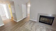 Located at 7525 Windbridge Dr in Sacramento, CA, this single-floor, one-bedroom, one-bathroom residence offers a well-organized and efficient layout. The kitchen is equipped with warm honey-toned oak cabinetry providing ample storage, white appliances including a refrigerator, range, and dishwasher, a stainless sink, and tile backsplash accents. Light wood-style flooring runs throughout the kitchen and main living areas, giving the space a clean and cohesive feel. The spacious primary bedroom features plush wall-to-wall carpeting, a large window dressed with vertical blinds that invites natural light, and a dedicated walk-in closet with built-in rod and shelf storage. A separate closet is also accessible directly from the bedroom, offering additional organization options. The bathroom is finished with wood-toned cabinetry beneath a granite-style countertop vanity, a large mirror, and a full shower-tub combination with a curved curtain rod. Neutral, warm-toned walls throughout contribute to a calm and inviting ambiance. The 3D overview reveals a compact but thoughtfully arranged floor plan with clear separation between living, sleeping, and utility areas, making efficient use of every square foot.