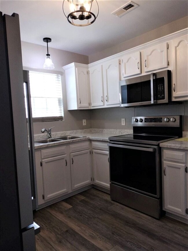 Building Photo - You'll Love the Modern Upgrades in this Fu...