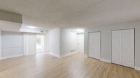 Located at 15 Fox Hall in Newark, Delaware, this single-floor, 2-bedroom, 1-bathroom residence offers a practical and well-organized layout. The combined living and dining area forms the heart of the home, featuring warm light wood laminate flooring, crisp white walls, and a textured ceiling that extends throughout the main living spaces. Large sliding doors lead to a private patio, allowing natural light to fill the open area. The kitchen connects conveniently to the living and dining space, complemented by a dedicated utility room and a hallway that ties the layout together efficiently. Both bedrooms are carpeted in a neutral tone, providing a comfortable feel, and each room is fitted with windows dressed in blinds that offer natural light and outdoor views. The primary bedroom is generously sized and includes two closet doors for ample storage. The second bedroom also features a window with a view of surrounding greenery. Notably, the home includes an impressive six closets in total, ensuring abundant storage throughout. The full bathroom is tastefully finished with white subway tile, a decorative mosaic accent border, and a tub-shower combination with chrome fixtures and a window for natural light. A patio rounds out the offering, providing a functional outdoor extension of the living space.