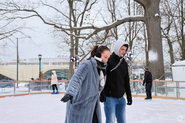 Ice Skaters enjoy the brisk winter day, at nearby Wade Oval Ice Rink, frequented by Eastsiders.