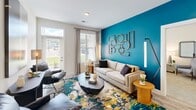Located in Knoxville, TN, this single-floor, 2-bedroom, 2-bathroom residence offers a thoughtfully designed layout with stylish finishes throughout. The open kitchen-living area makes an immediate impression, anchored by a striking teal accent wall that adds a vibrant focal point to both spaces. The kitchen is outfitted with white shaker cabinets, granite-style countertops, a subway tile backsplash, stainless steel appliances, and light wood-look flooring, with pendant lighting adding a modern touch. The adjoining living room is bright and welcoming, with large windows that invite natural light and provide access to the outdoors. The generously sized primary bedroom features plush carpeting, a ceiling fan, and ample natural light from multiple windows. It is complemented by a spacious walk-in closet with wire shelving, a hanging rod system, and built-in storage organizers. The second bedroom is equally well-proportioned. Both bathrooms are clean and efficiently designed with light, neutral finishes. A dedicated laundry room houses a full-size washer and dryer with overhead shelving. The home also includes a hallway, entrance foyer, and two closets, ensuring practical storage throughout. The overall aesthetic balances contemporary design with comfortable livability.