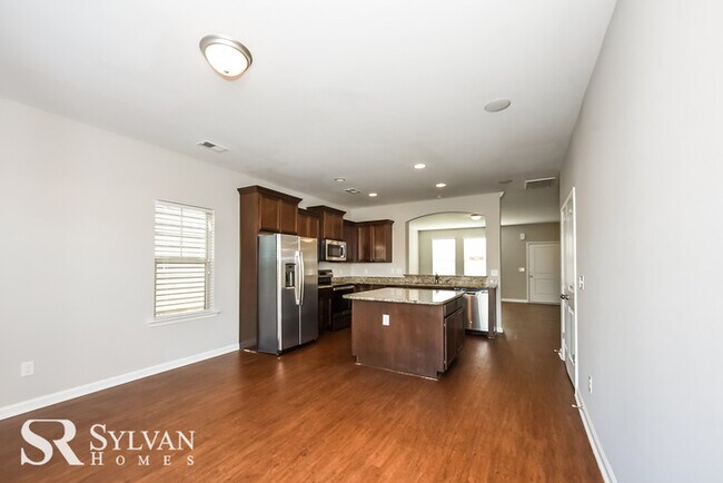 Building Photo - Fall in love with this spacious 4BR, 2.5BA...