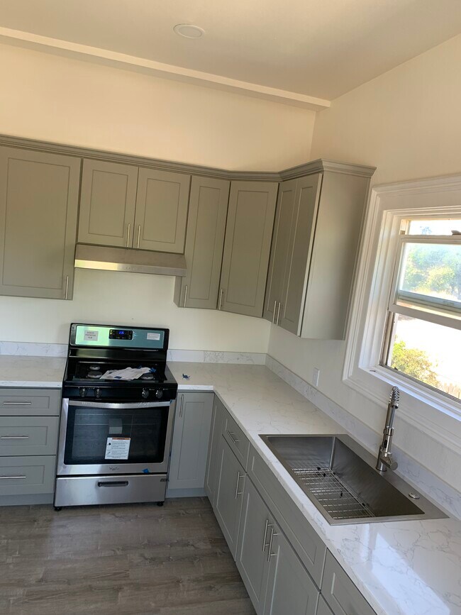 All new cabinets countertops appliances and sink - 128 Lewelling Blvd