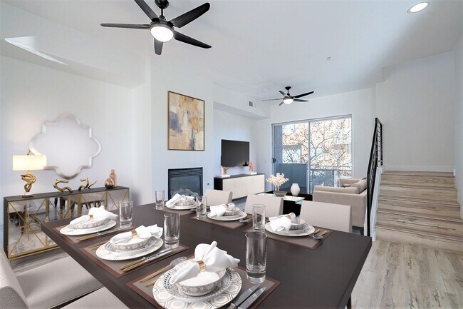 main livinging room with gas fire place open balcony - 6605 N 93rd Ave