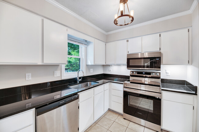 Updated kitchen with granite and stainless steel appliances - 5540 Kaplan Dr