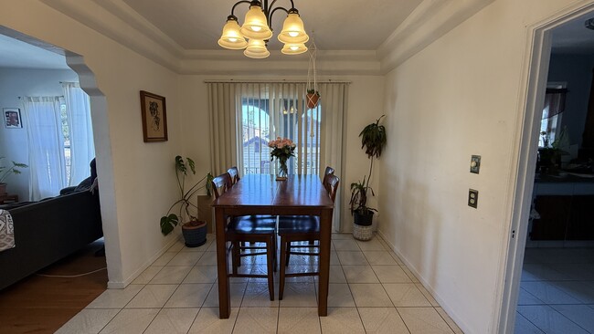 Dining room (example when furnished), living room on the left, kitchen on the right - 2817 S Sycamore Ave