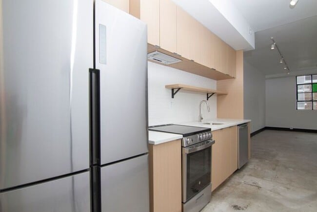 Building Photo - Check out this studio ! We want you to cal...