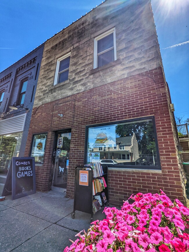 Downstairs is a Bookstore - 108 E Main St